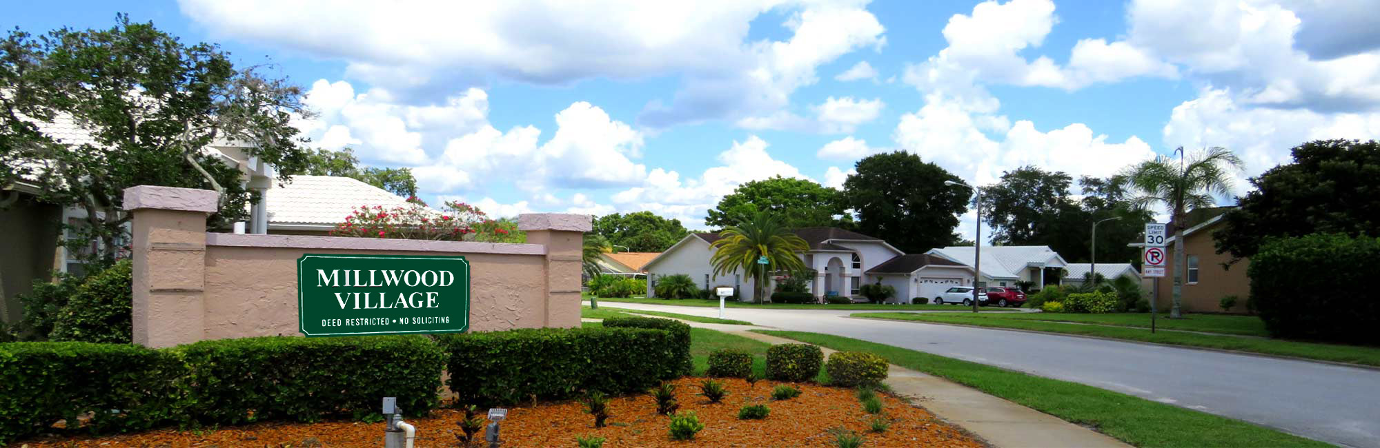 An entrance to Millwood Village from Library Road, Hudson Florida